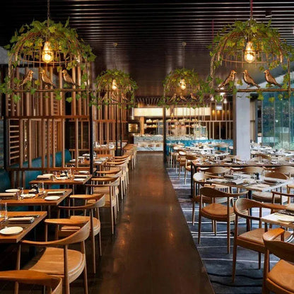 ECLAIRAGE SUSPENSION Suspension oiseau en fer forgé